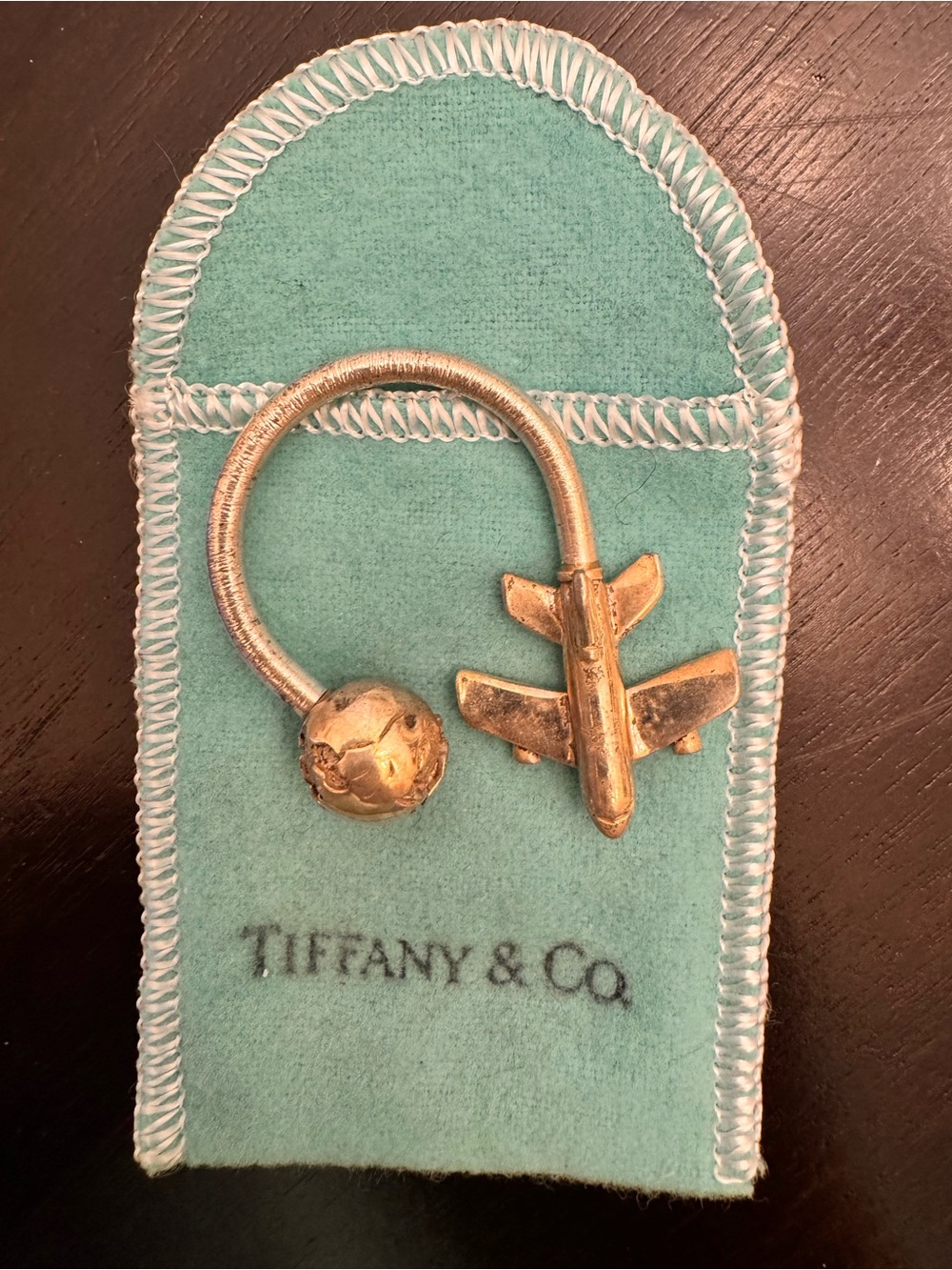 TIFFANY & CO Sterling silver airplane & globe key ring.  Retired style.